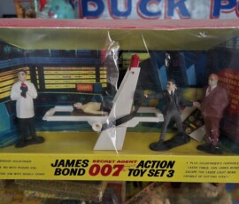 1960s James Bond figures and playsets made by Gilbert (you can actually reenact the horrifying laser cutting torture scene from Goldfinger, in this little playset made for children....it was a different time....) James Bond 007 Action Toy set with James Bond strapped to Goldfinger's horrible laser table.
